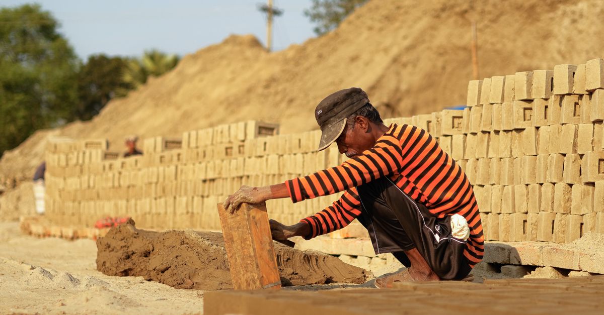 A mason working with mortar and trowel