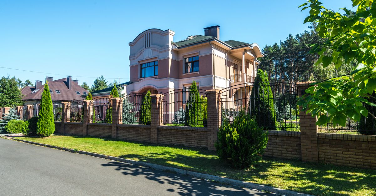 A fence and gate at a property line