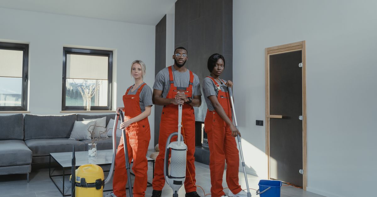 A cleaner tidying a room