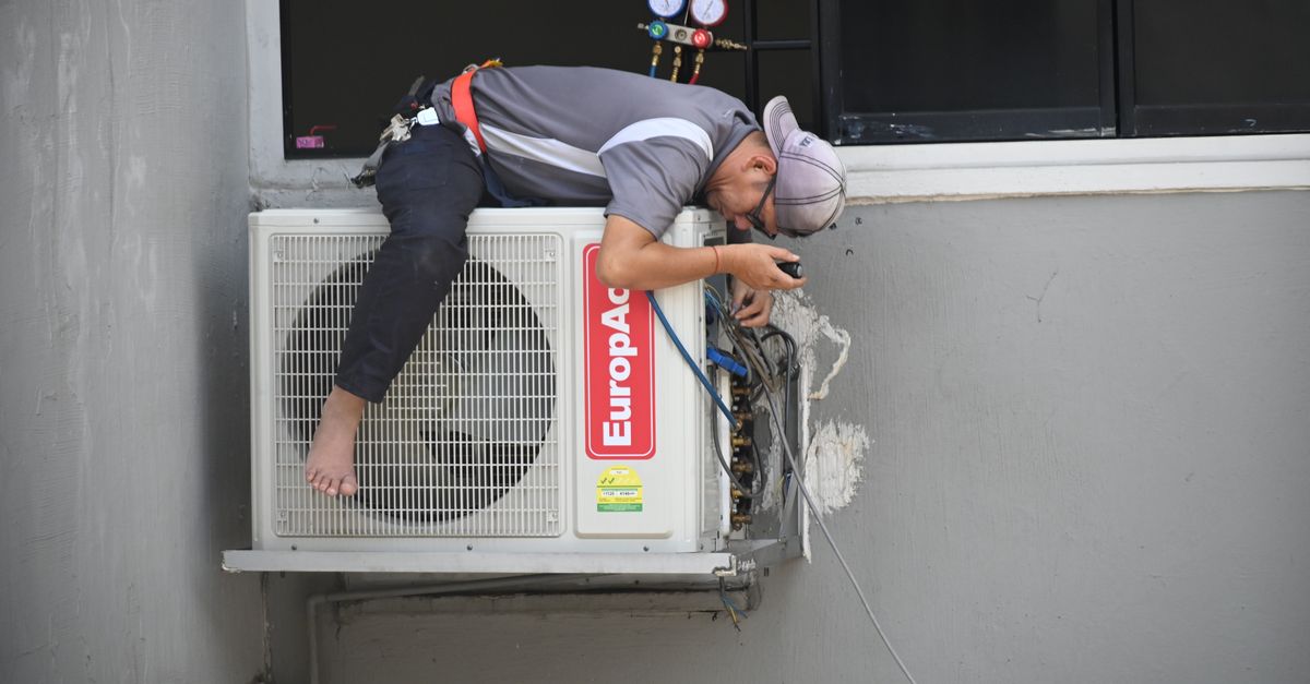A technician checking a furnace