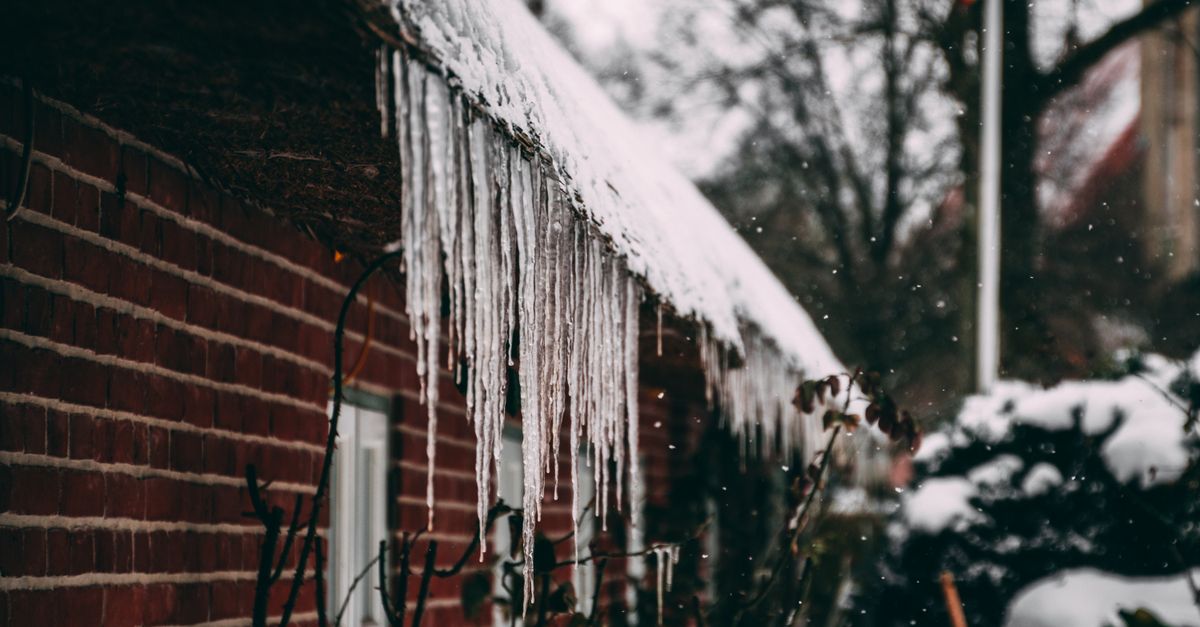 Ice and icicles along a roof edge