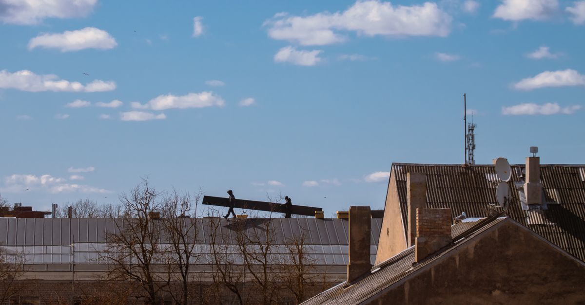 A roofing contractor on a roof