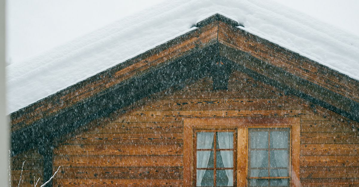 A house roof under snow