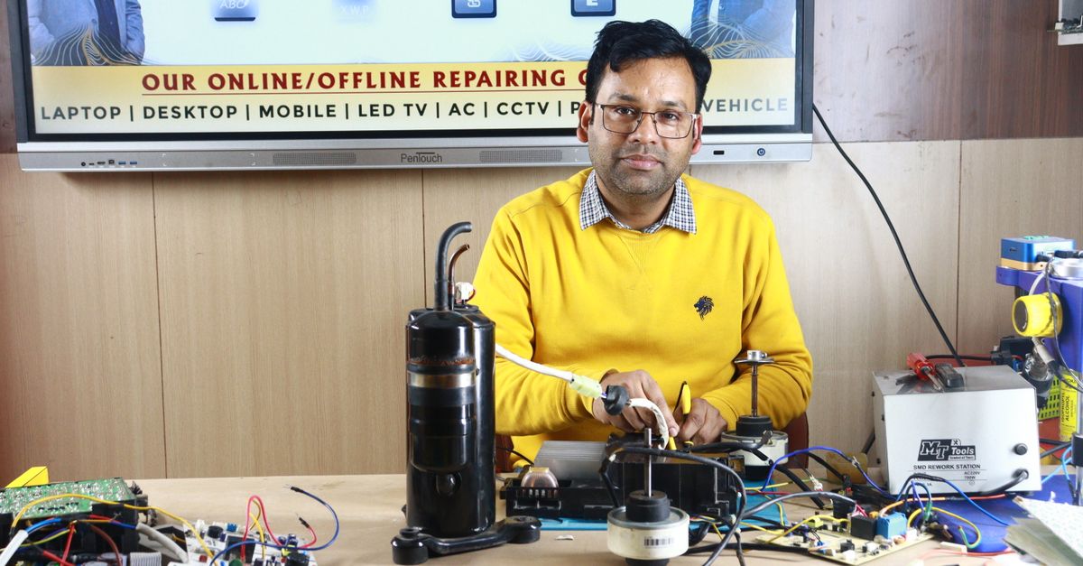 A technician checking an AC unit