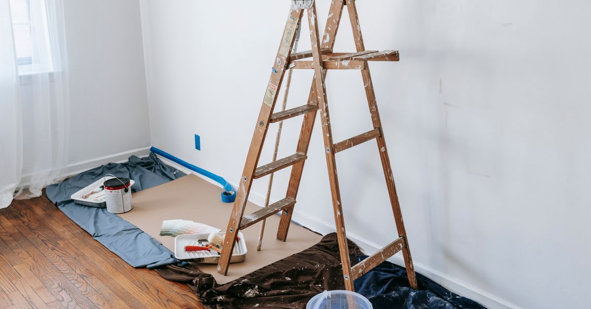 Painter tape and drop cloths in a room