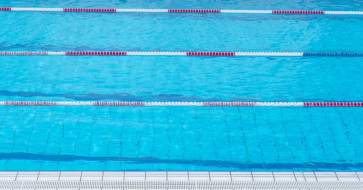 A pool net skimming water