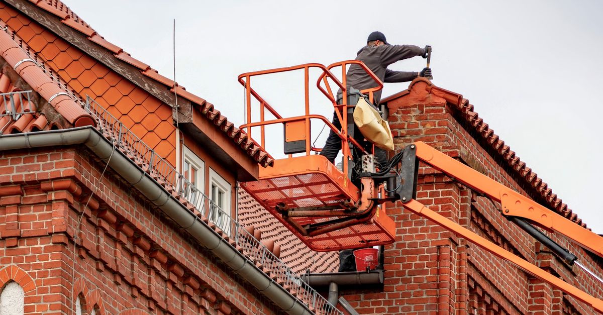 An inspector examining a roof