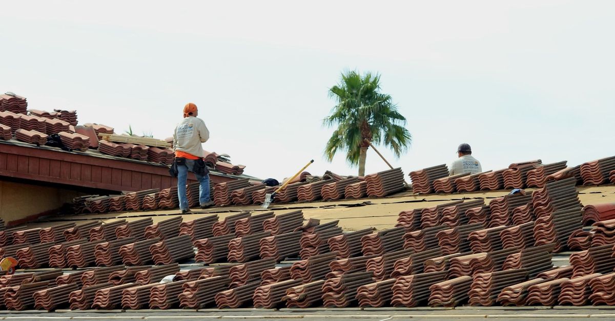 A roofer on a residential roof