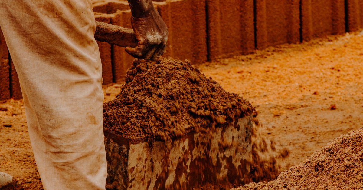 A mason working with mortar and trowel