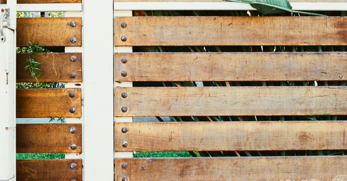 A broken fence board