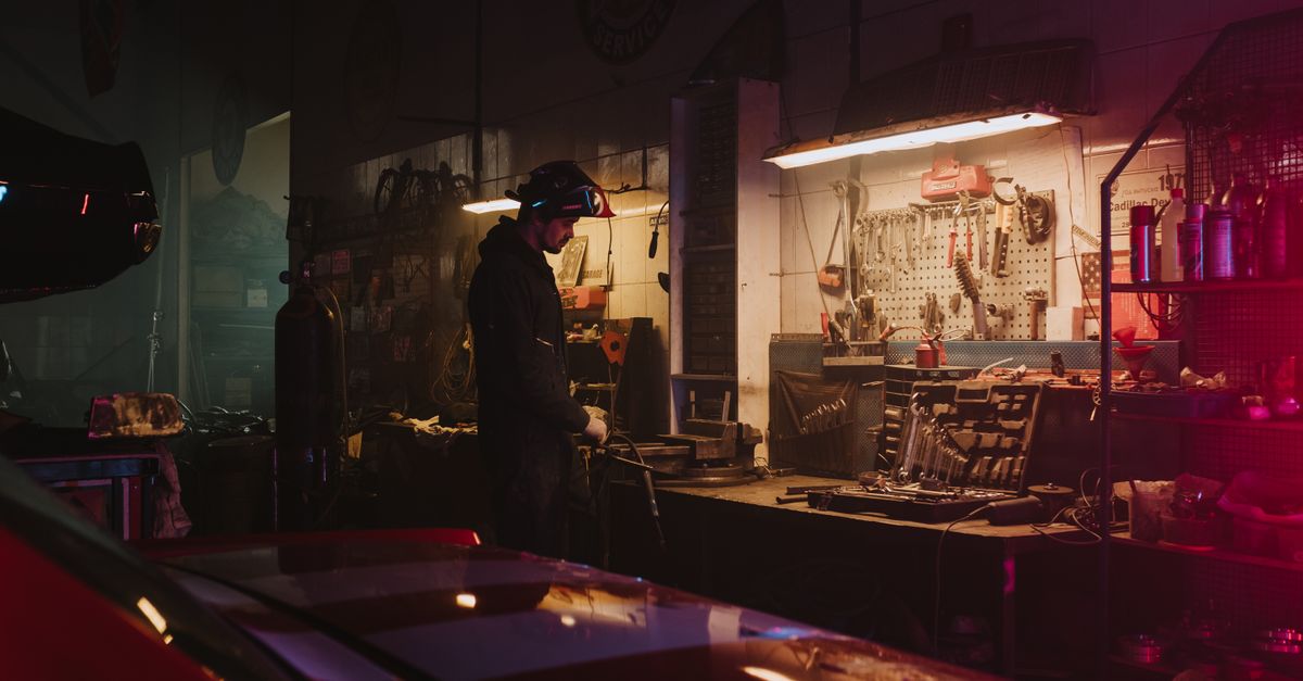 A technician working on garage door hardware