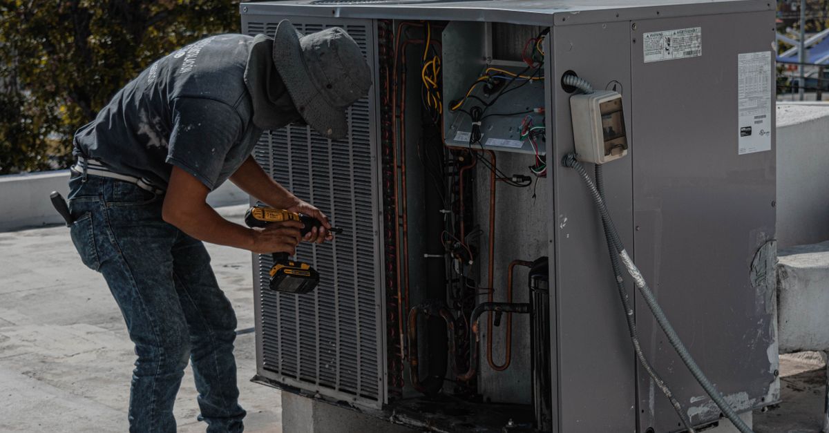 A technician explaining an AC repair