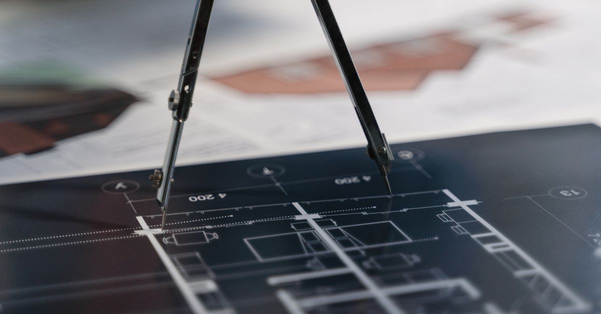 A rolled blueprint and permit forms