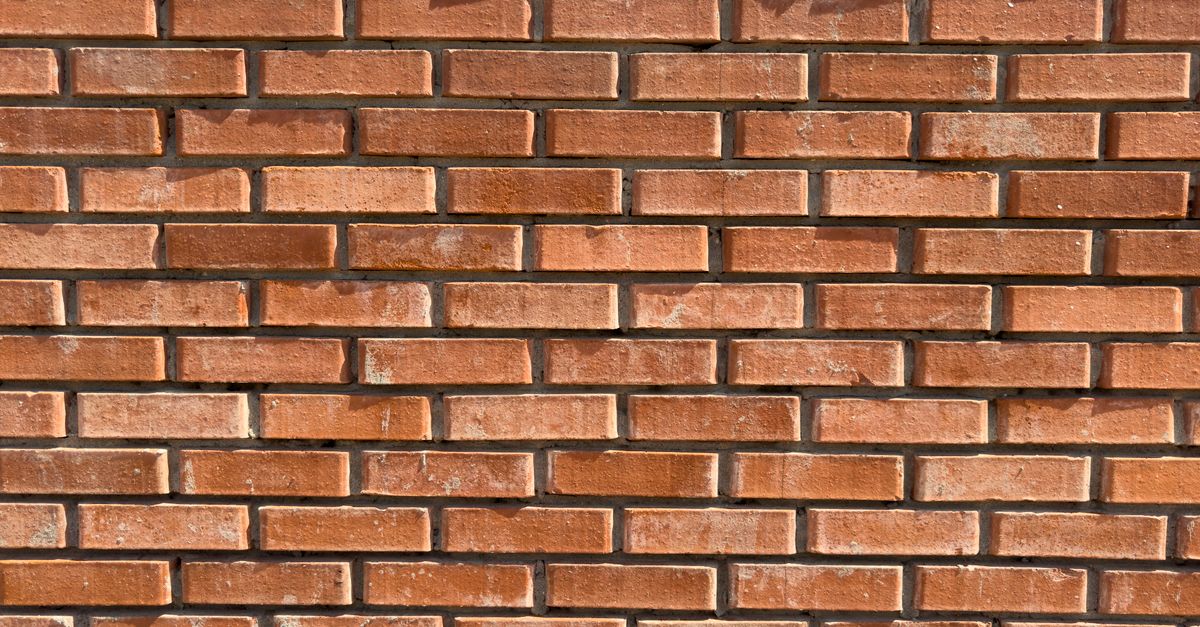 A well-kept brick and masonry wall