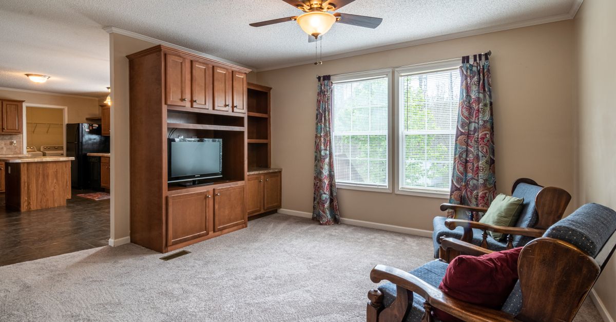 A modern ceiling fan in a bright room