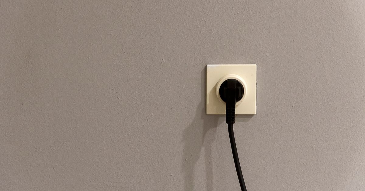 A wall outlet being checked