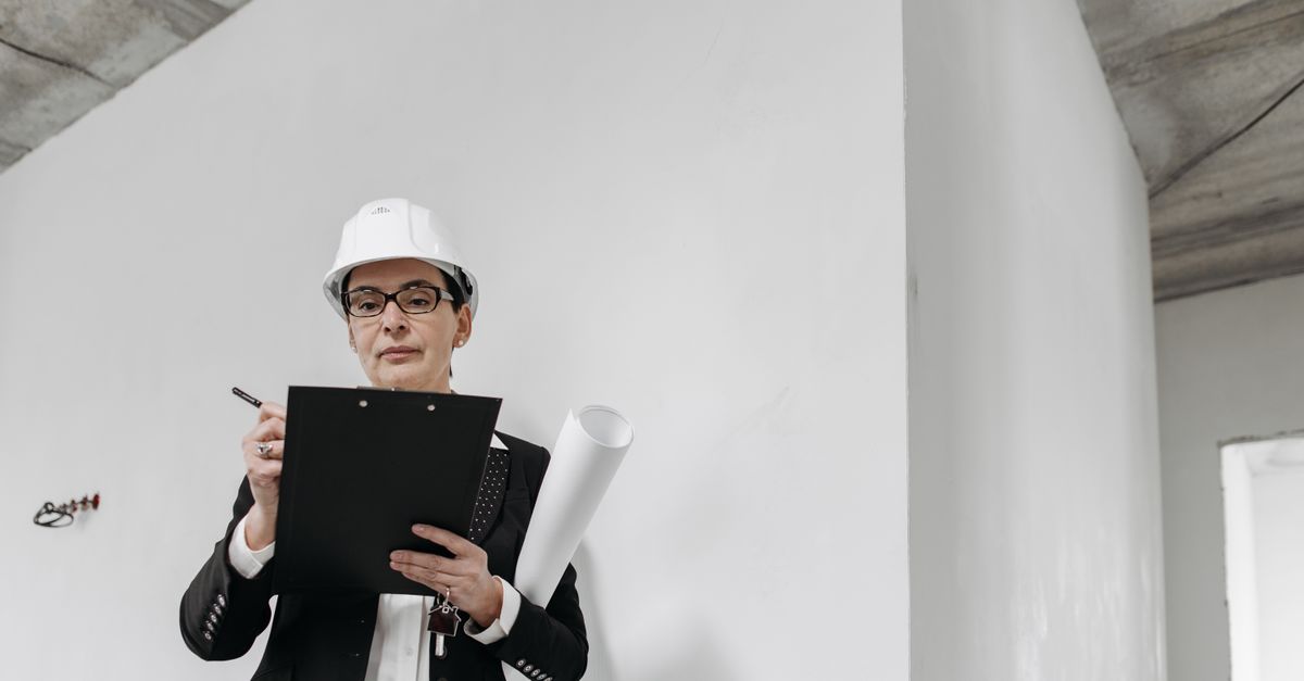 A contractor reviewing an estimate on a clipboard