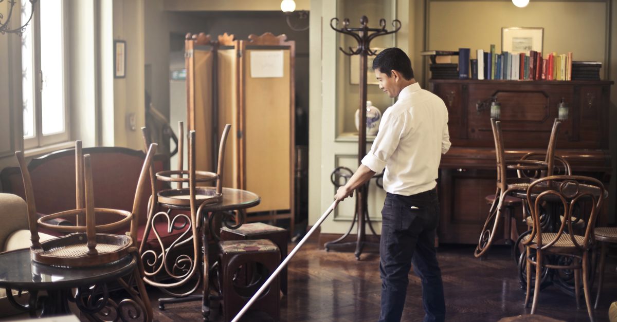 A floor being mopped and cleaned