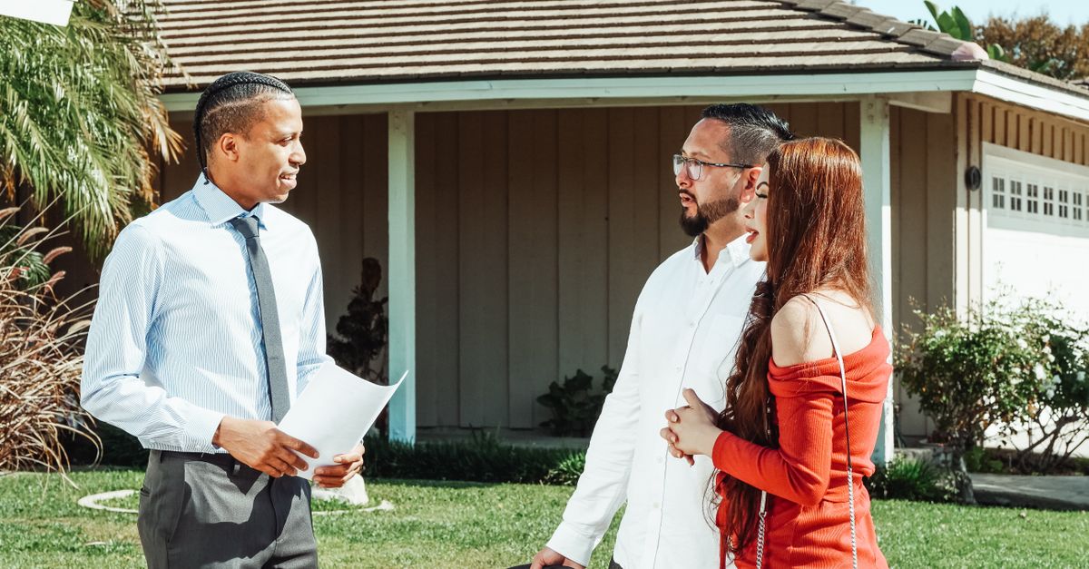 An electrician discussing work with a homeowner