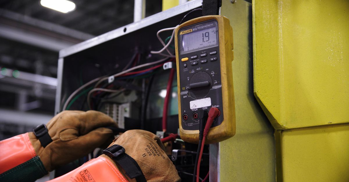 An electrical panel being inspected