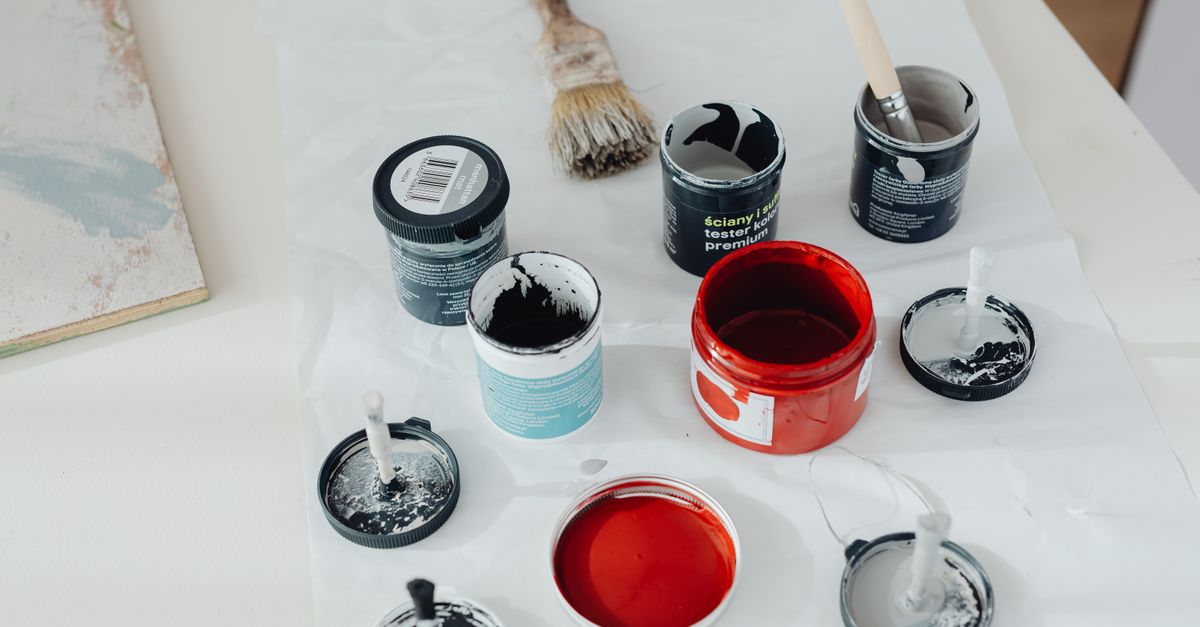 Paint cans and brushes ready for a project