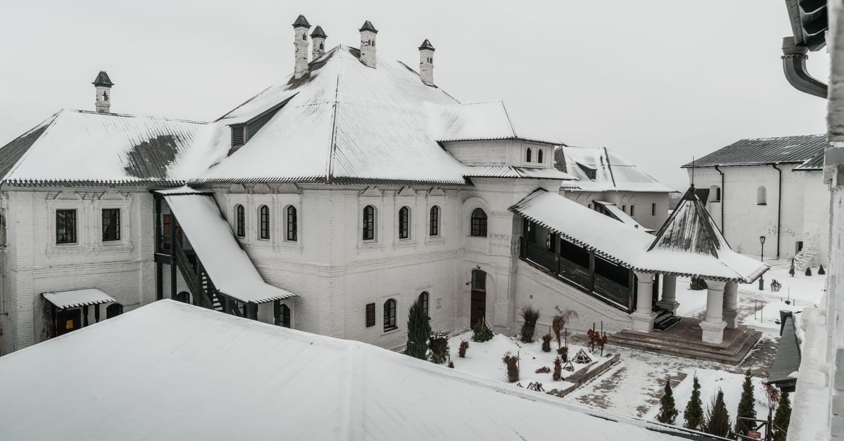 A snow-covered residential roof in winter