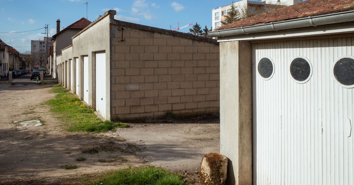 A garage door with a broken torsion spring