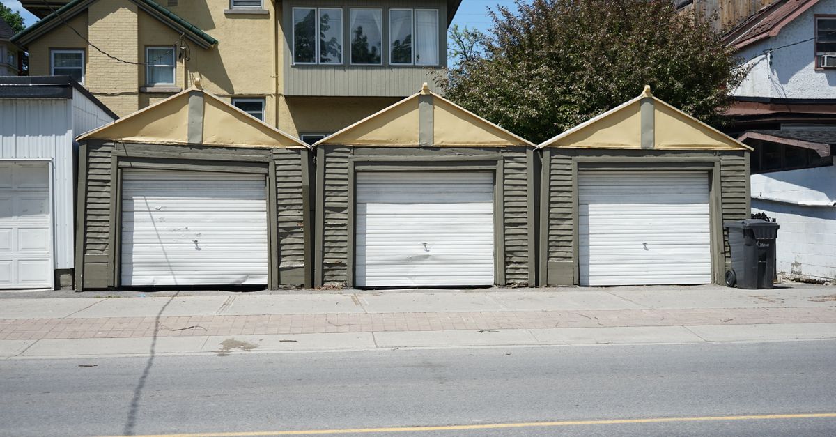 A residential garage exterior with a new door