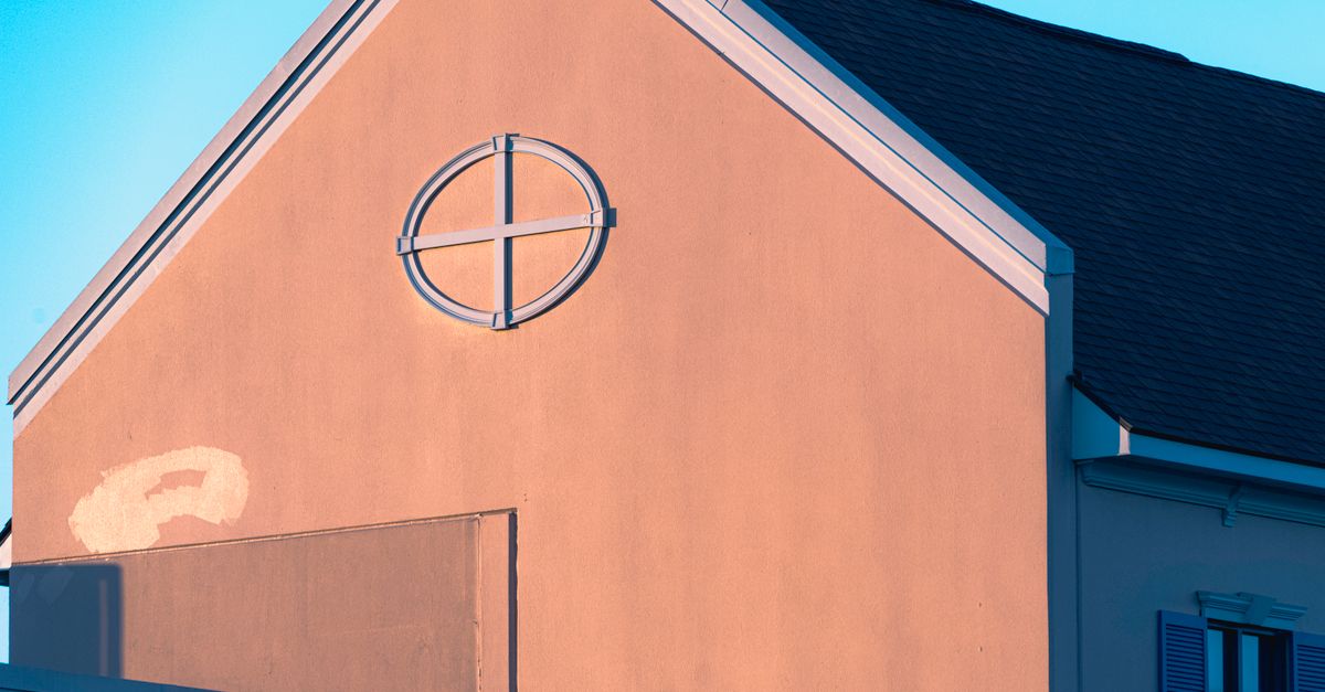 A sun-exposed stucco home exterior