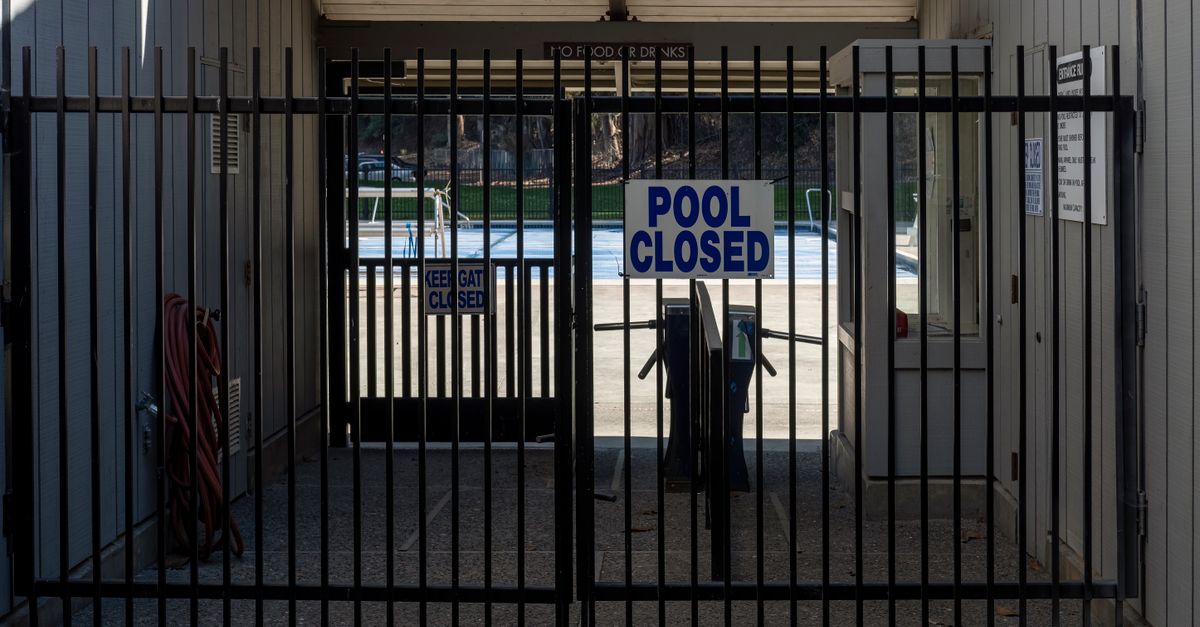 A safety fence around a backyard pool