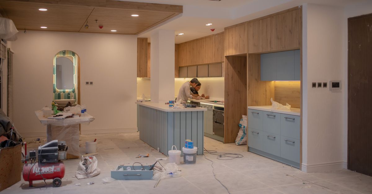 Tile flooring being installed in a kitchen