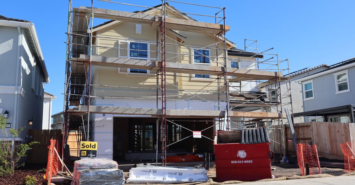 A contractor going over an estimate with a homeowner