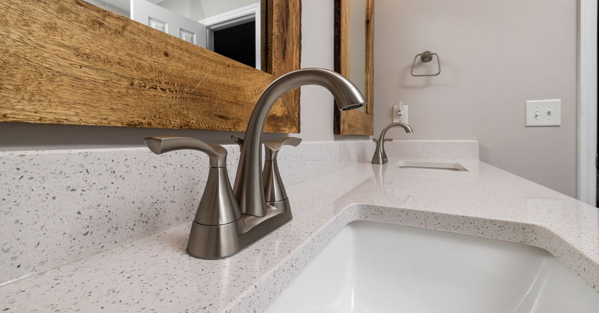 Hard water buildup around a faucet