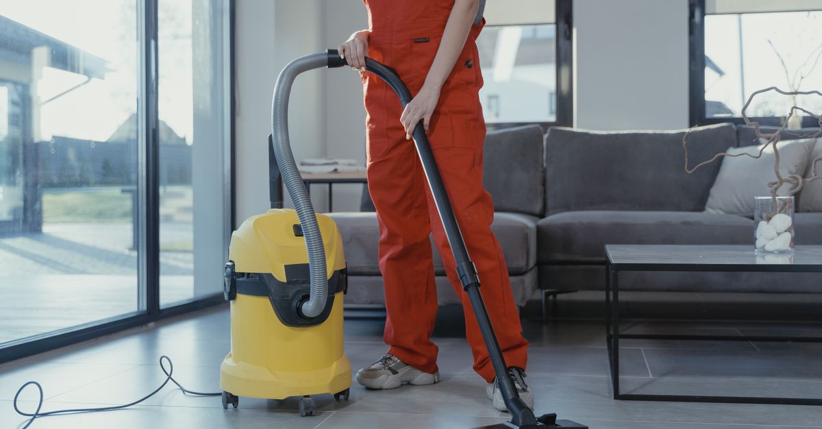 A professional cleaner working in a home