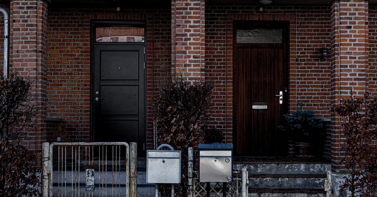 A salesperson at a front door