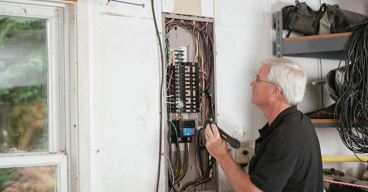 An electrical panel being inspected