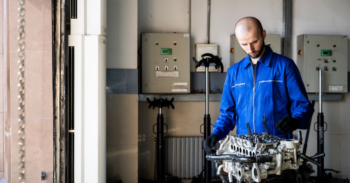 A garage door technician inspecting a door