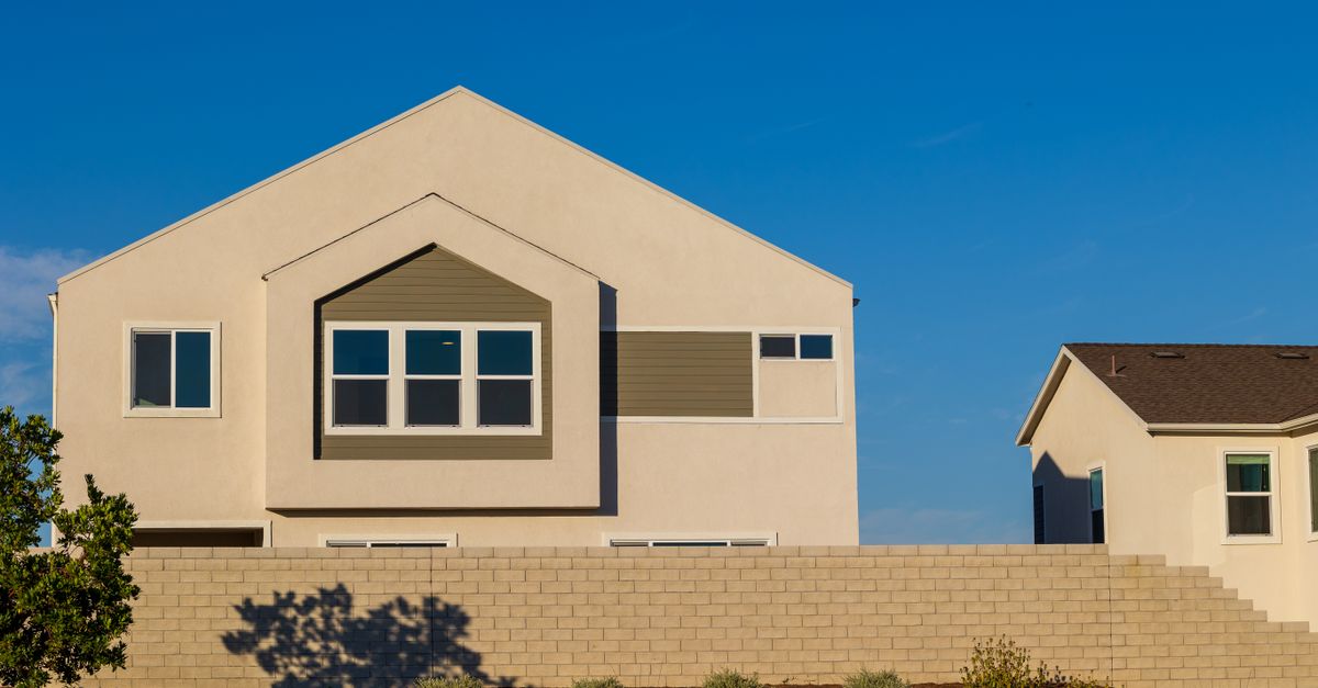 A sun-exposed stucco home exterior