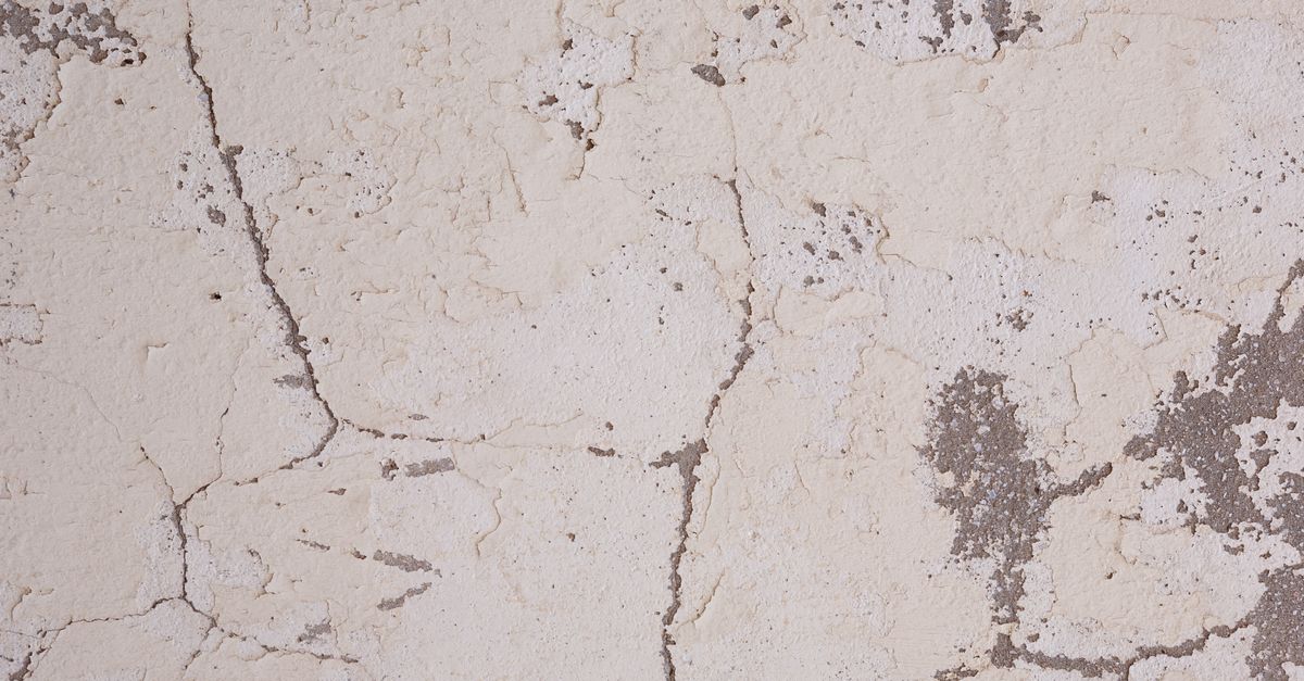 A crack in a pool deck or shell
