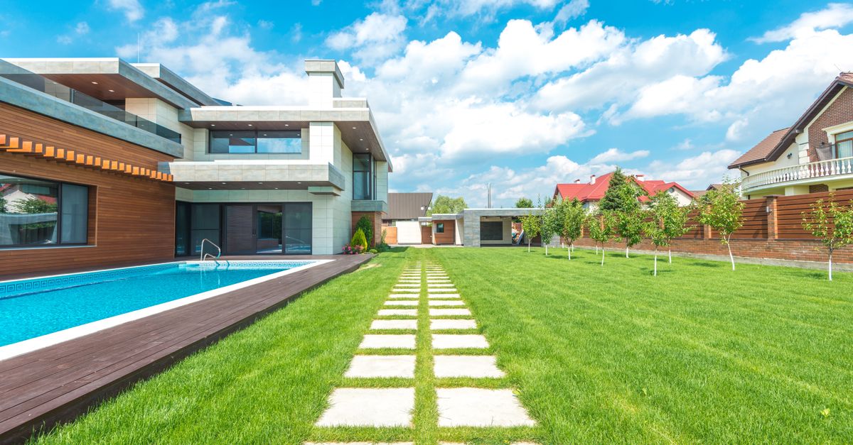 A backyard swimming pool under construction