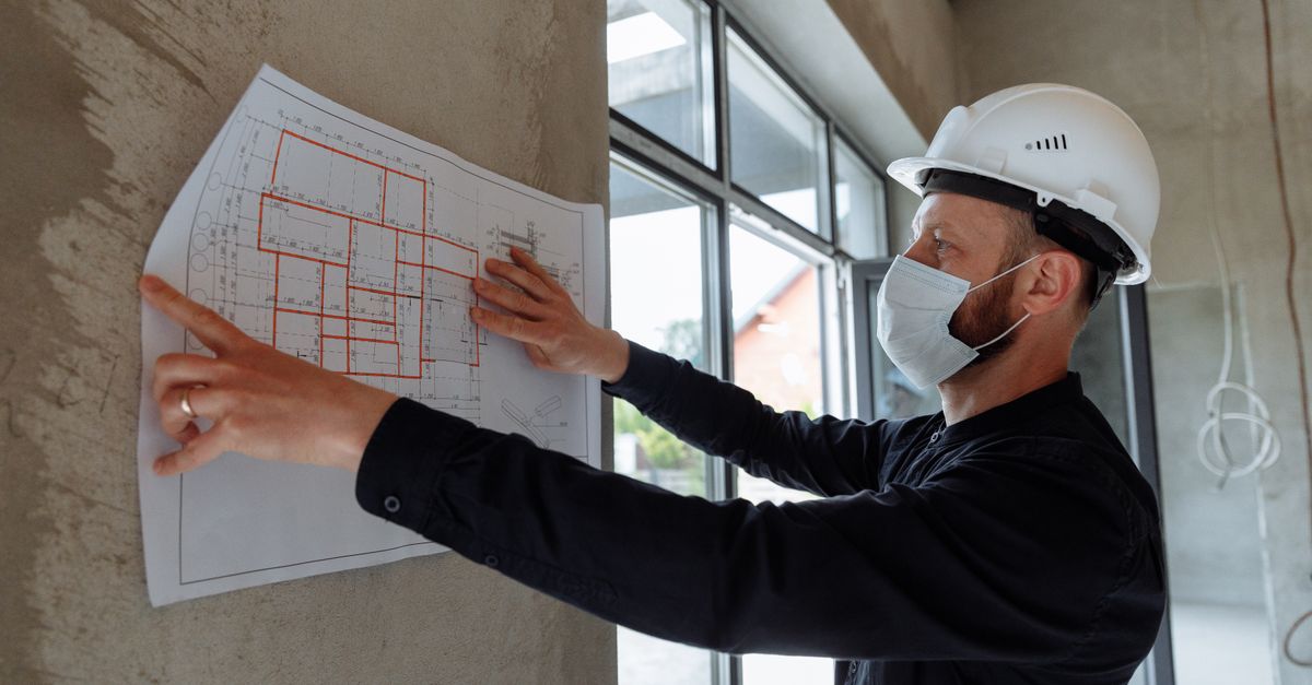 A pool contractor reviewing a project plan